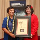 Misa Emma Kesha (left) with the senior Pacific artists award and Pacific Arts Committee...