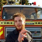 Mischael Palmer (22) and his fire engine earlier this week. Photo by Peter McIntosh.