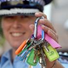 Missing something? . . . Inspector Amelia Steel displays a large bunch of keys which the police...