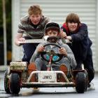 Mitchell Scammell (15) gets a push start from fellow John McGlashan College pupils Malcolm...