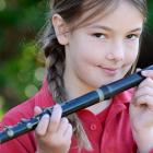 Mornington School pupil Ella Moses holds a fife from the school's former fife and drum band....