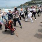 Morris dancers perform  at St Clair yesterday, during a visit to the city as part of a national...