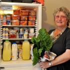 Mosgiel Community Food Bank co-ordinator Michelle Kerr with a small fridge for storing fresh food...
