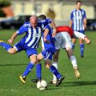 Mosgiel's Kris Wheeler lines up the ball during a Footballsouth Premier League match at Memorial...