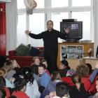 Motivational speaker Marcus Akuhata-Brown (centre) sows the seeds of inspiration among pupils at...