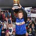 Motocross rider Courtney Duncan shows off the trophy she won at women’s world motocross...