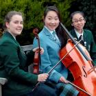 Mousikos Trio members (from left) Annabel Drummond (16), Hannah Kim (16) and Modi Deng (14) have...