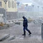 Murray Costello struggles against the sleet and snow on the Esplanade at St Clair yesterday as...