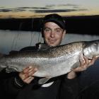 Nathan Garner (32), of Mosgiel, shows a 5.4kg sea-run trout he caught using a worm in the lower...