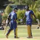 Nathan McCullum (left) is congratulated by Dimitri Mascarenhas after reaching his 50 at the...