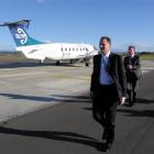 National leader John Key exits his chartered campaign plane at the airport in Napier today. Photo...