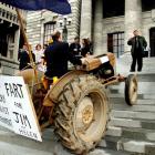 National MP Shane Arden drives a tractor called Myrtle up the steps at Parliament during a...