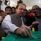 Nawaz Sharif, leader of the Pakistan Muslim League - Nawaz (PML-N) political party, casts his...