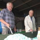 Neil McArthur (left) and Brian Phillips, both of Alexandra,   paint  the St John float for the...