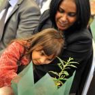 New citizen Rosie Melrose, formerly of Fiji, shows her New Zealand-born daughter Bianca (4) the...