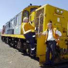 Andy Seymour (left) and Grant Craig of the Taieri Gorge Railway Trust check out the latest...