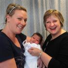 New mother Rebecca Cocker (left) and her daughter Bella Clarke have a grit truck driver to thank...
