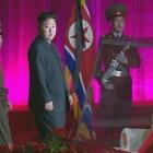 New North Korean ruler Kim Jong-un (centre) pays his respects to his father and former leader Kim...