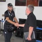 New Zealand captain Daniel Vettori  is greeted by Queenstown liaison manager Ian Paterson as the...