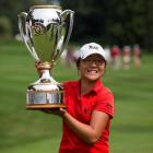 New Zealand golfer Lydia Ko holds the trophy after winning the LPGA Canadian Women's Open in...