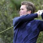 New Zealand men's under-19 championship winner Simon Brownlee follows the path of his tee shot...