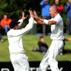 New Zealand paceman Chris Martin (right) celebrates with team-mate Kane Williamson after taking...