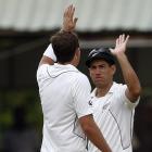 New Zealand's captain Ross Taylor (R) celebrates with compatriot Tim Southee after taking the...