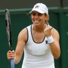 New Zealand's Marina Erakovic celebrates beating Peng Shuai of China in their women's singles...