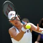 New Zealand's Marina Erakovic hits a return to Britain's Laura Robson during their women's...
