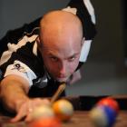 New Zealand's No 1-ranked pool player Adam Marlow lines up a shot at a Dunedin hotel yesterday....