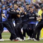 New Zealand's Trent Boult (C) is surrounded by team mates as they celebrate dismissing Australia...