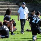 New Zealand Schools coach Karl Jones talks to his side at the final training run at Littlebourne...