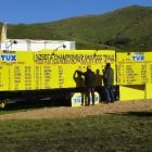 New Zealand Sheep Dog Trial Association volunteers update the leader board on the final day of...
