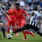 Newcastle United's Yohan Cabaye (L) and Chieck Tiote challenge Liverpool's Daniel Sturridge...