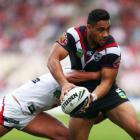 Ngani Laumape of the Warriors is caught by a Dragons tackler during their at WIN Stadium in...