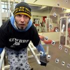 Nick Chisholm works  while communicating with trainer Shane Waldron through an alphabet grid....
