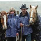 Nicky and Neil Rutherford with Solo (left) and River (right) yesterday. Another of their horses,...