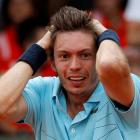 Nicolas Mahut of France celebrates after winning his match against Martin Klizan of Slovakia at...