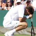 Nicolas Mahut of France takes a break, during his marathon men's singles match against John Isner...