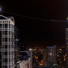 Nik Wallenda walks the tightrope suspended between two skyscrapers 500 feet (152.4m) above the...