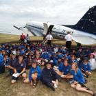 Ninety pupils from the Maniototo Area School wait to be shown around the DC-3 at Idaburn...