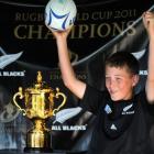 Noah Wray (11), of Dunedin, has his picture taken with the Rugby World Cup, the Webb Ellis Trophy...