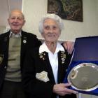Noeleen Scott, of Cromwell, with husband Bill and the plate she was given when inducted into the...