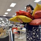 Nood staff member Elizabeth Marshall carries cushions for sale in a new Dunedin shop opening on...