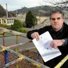 North East Valley Normal School board of trustees chairman Steve O'Connor with incomplete mid...