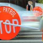 North East Valley Normal School pupils Bella Reid (left) and Sierra Sawyers (both 10) patrol a...