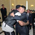 North Korean leader Kim Jong-un (right) and former NBA basketball player Dennis Rodman  hug in...