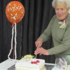 North Oamaru RSA Women's Section past president Joan Williams cuts the cake, during celebrations...