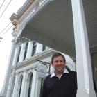 North Otago Club president Peter Garvan stands under the restored Tees St veranda. Photo by Sally...