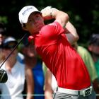 Northern Ireland golfer Rory McIlroy hits a drive on the second tee during round one of the BMW...